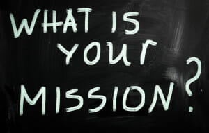 "What is your mission " handwritten with white chalk on a blackb/business mission/business vision/sanespaces.com