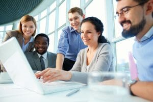 business team working on computer, diversity in small business.
